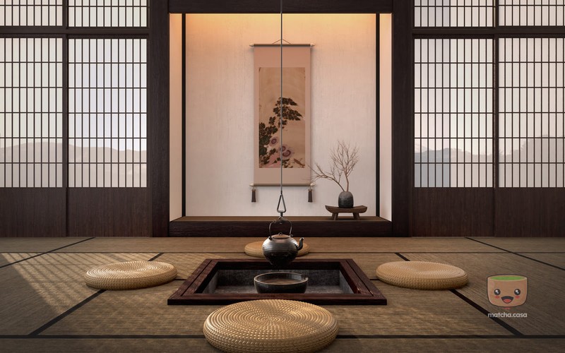 un chashitsu avec 4 coussins, une théière au milieu et une peinture au fond